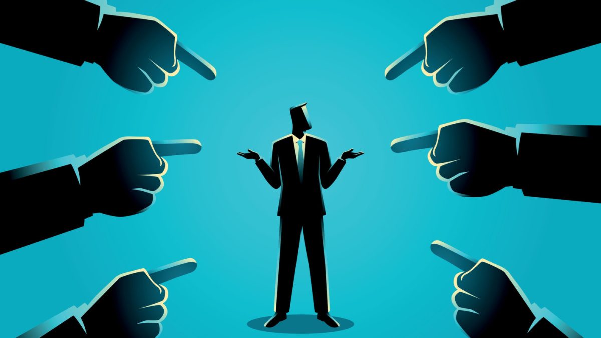 illustration of a businessman being pointed by giant fingers