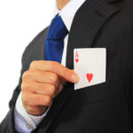 ace of cards in business suit pocket
