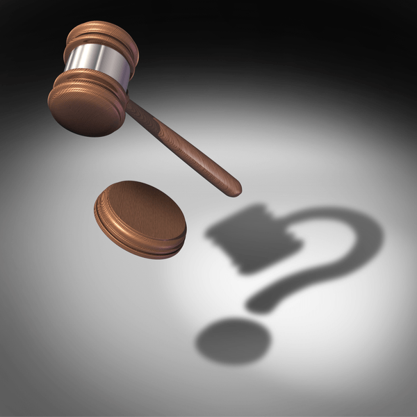 gavel with question mark shadow